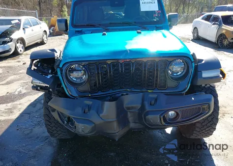 2024 Jeep Wrangler 4-Door Willys 4X4 z USA, uszkodzony, nr VIN 1C4PJXDN4RW157857